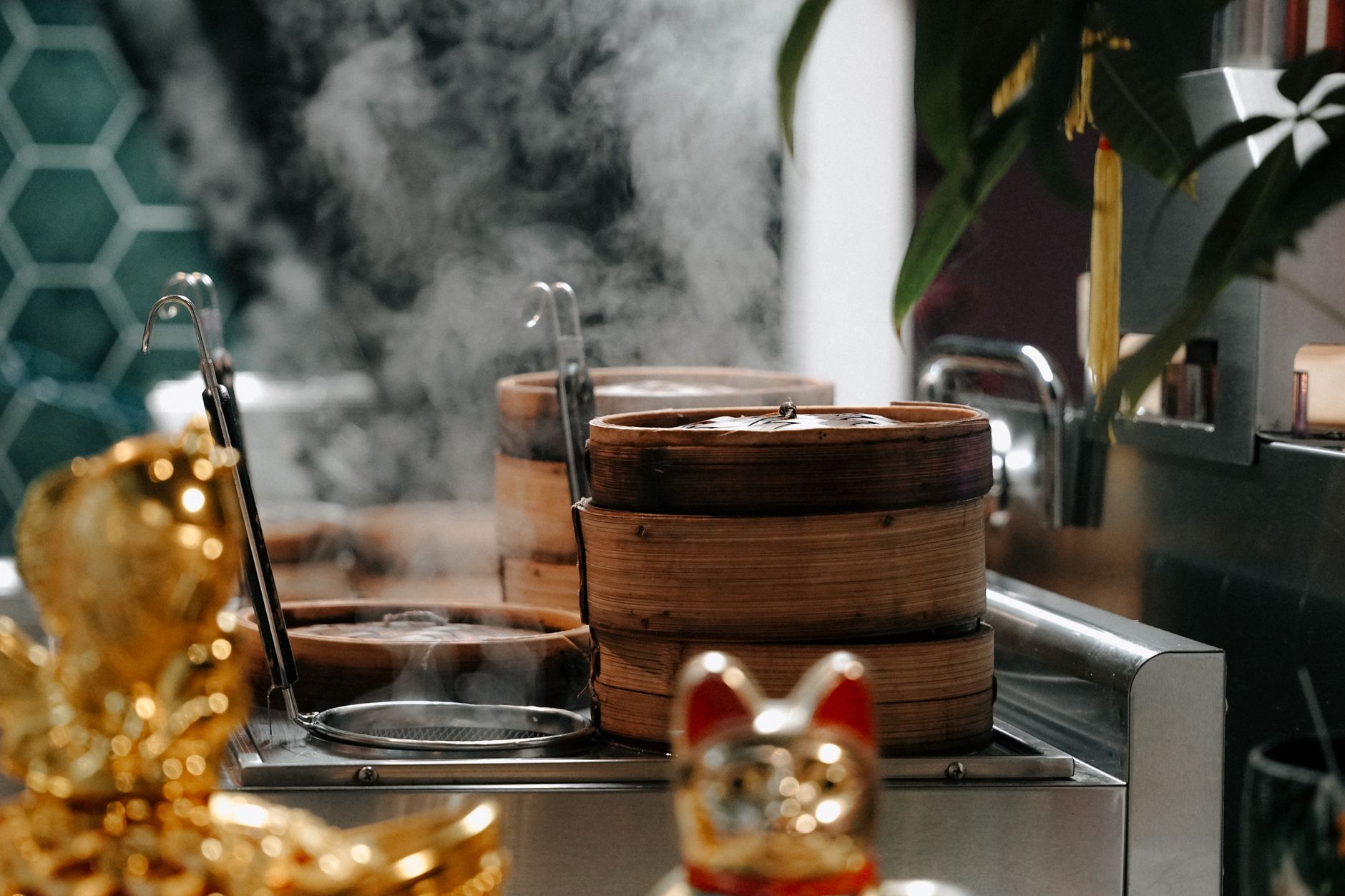 Steaming bamboo dim sum baskets stacked at an Asian restaurant