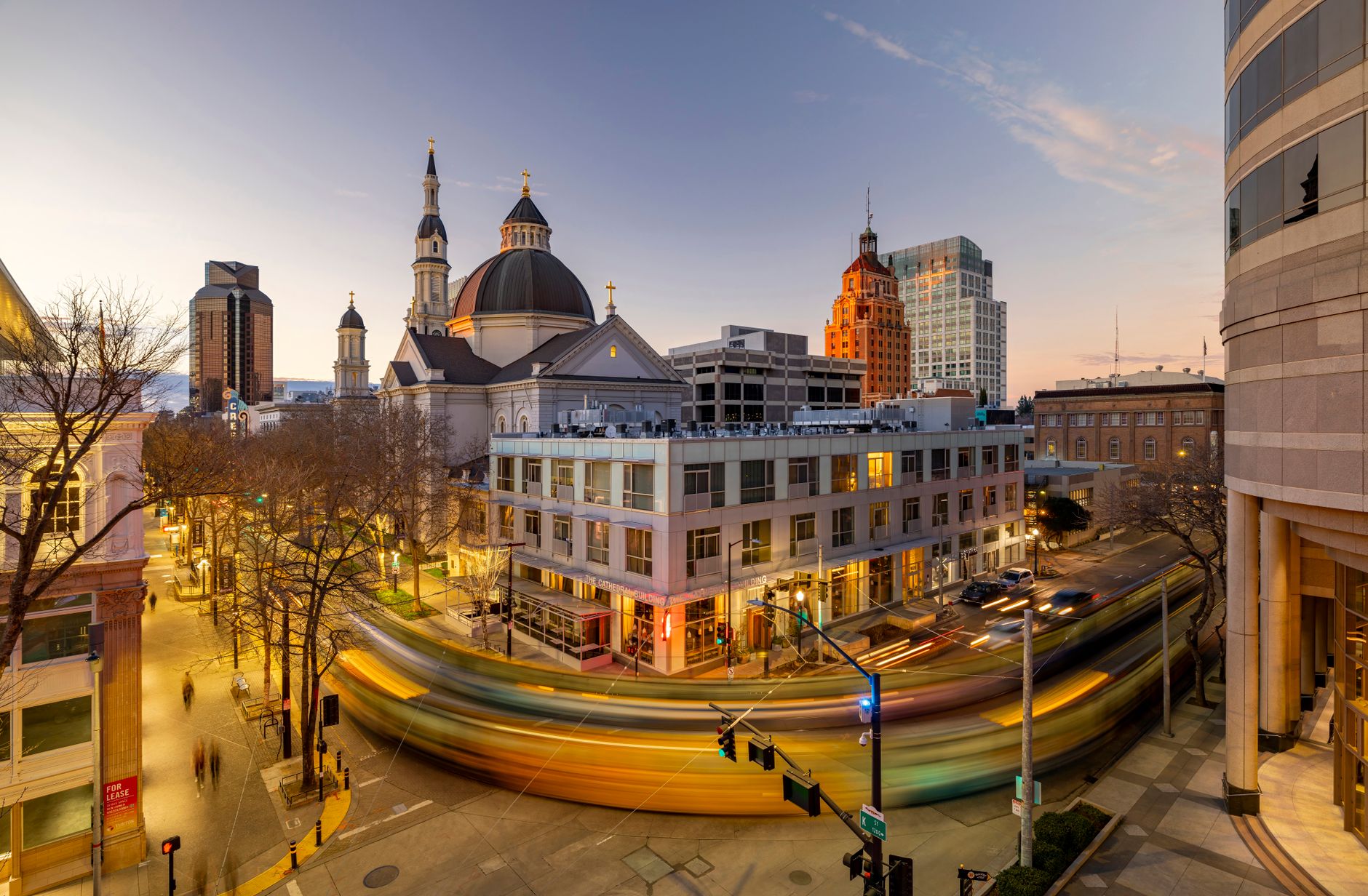 Downtown street lit up at dusk