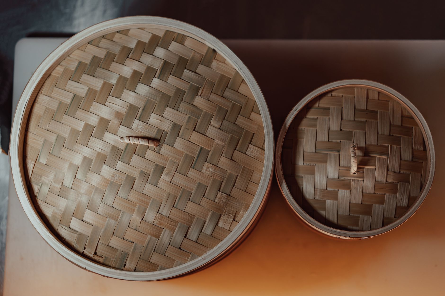 Bamboo dim sum steamer baskets stacked from above