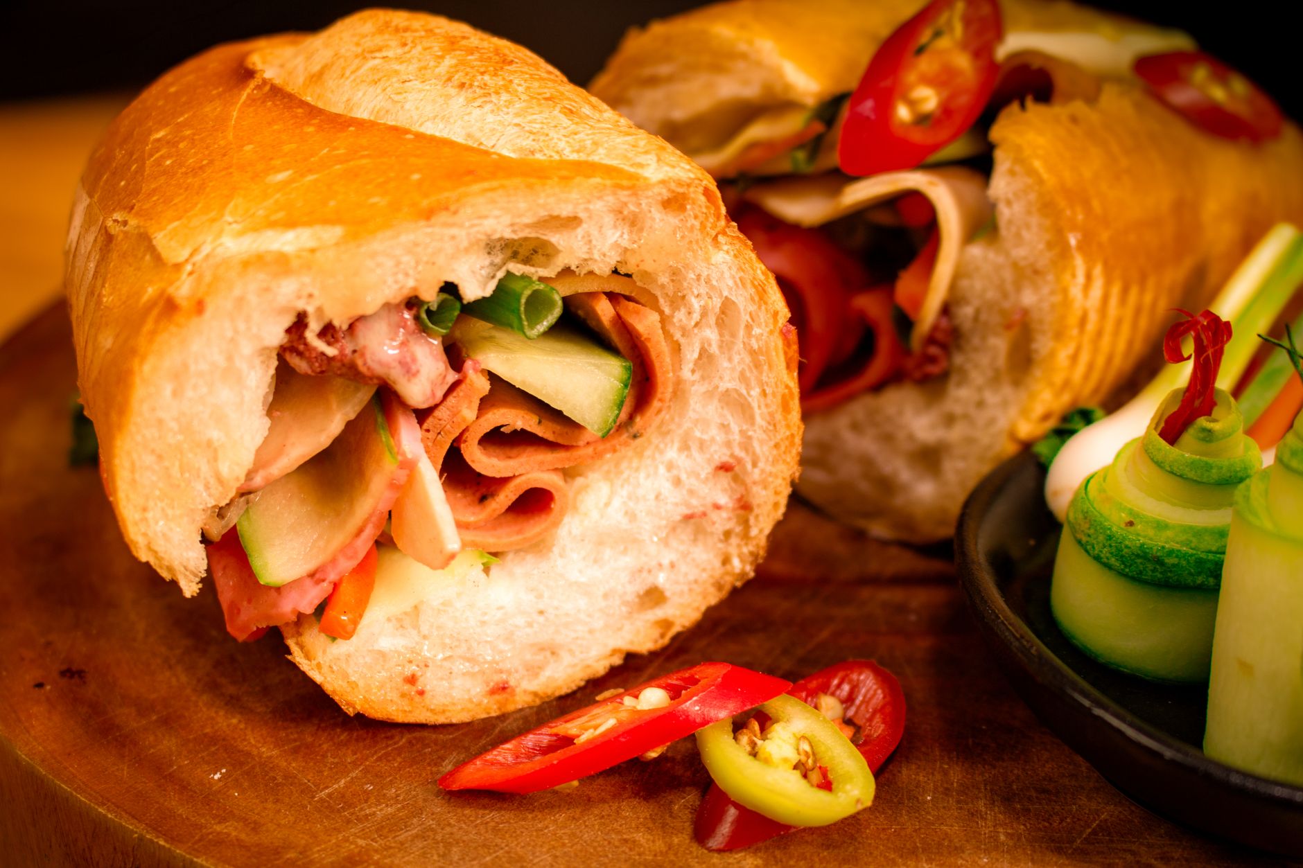 Close-up of a Vietnamese banh mi sandwich with fresh vegetables