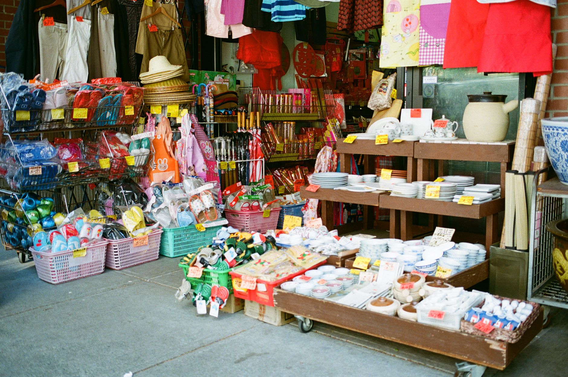 Colorful display of goods outside a Chinatown market storefront