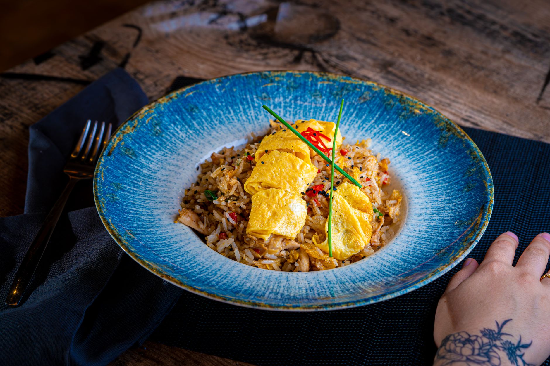 Fried rice topped with an omelette, a common side in Chinese combination dinners